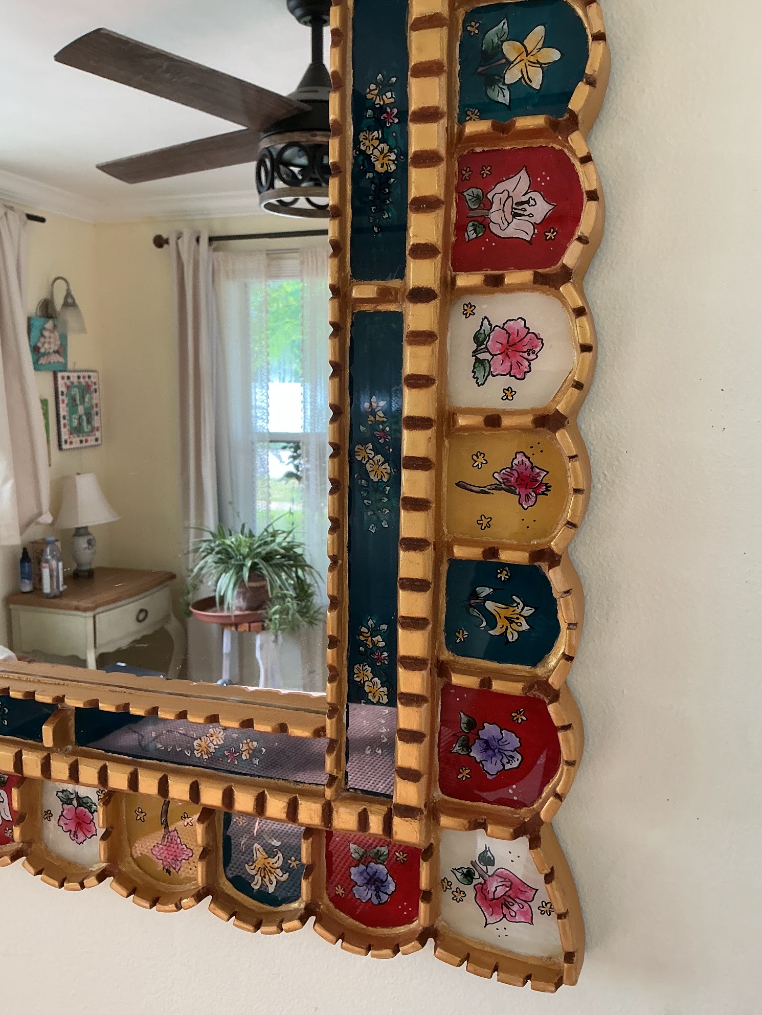 Close-up of the hand-painted flowers and carved edge on Mediterranean Gold