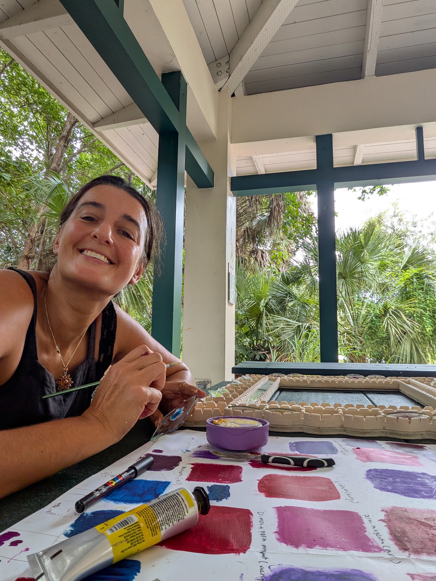 Painting the decorative panels in Ulviya Bemman's mirror-making process