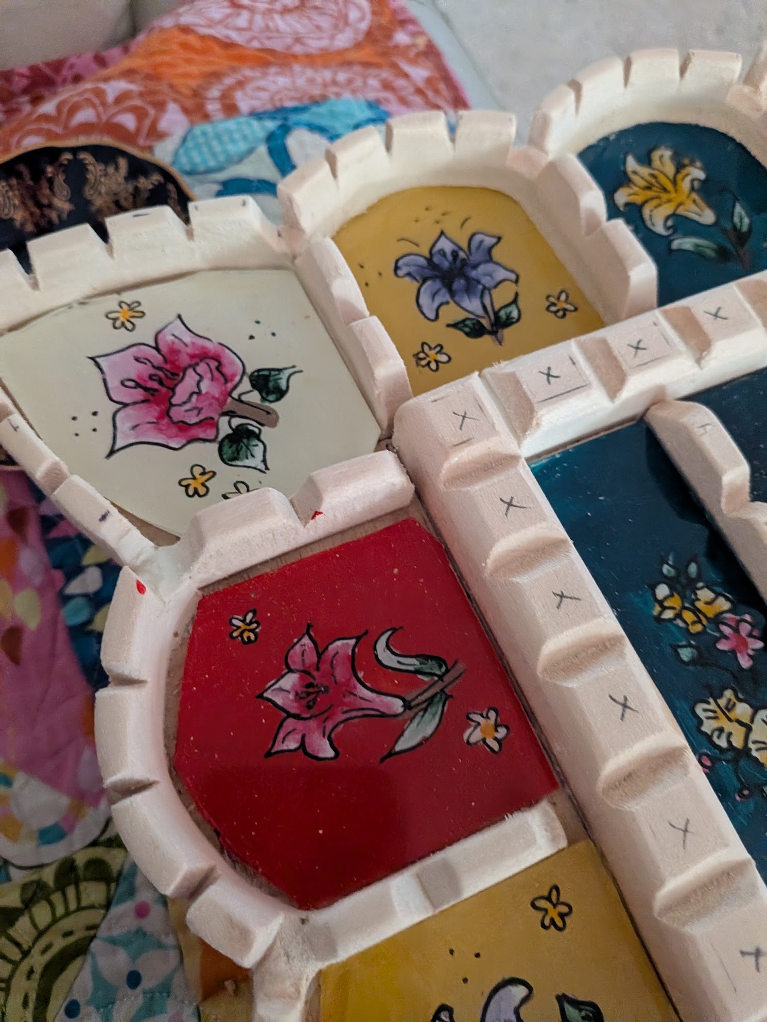 Testing the painted pieces in Ulviya Bemman's mirror-making process